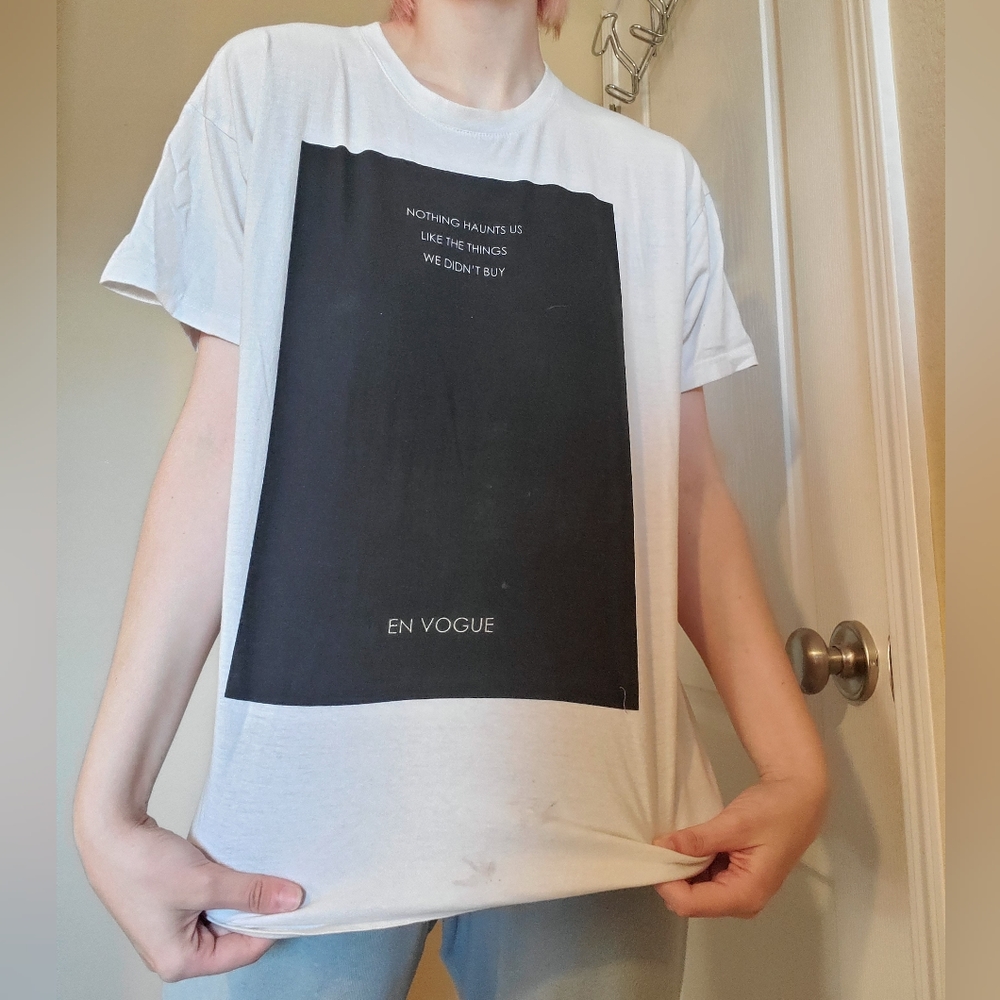 "Nothing Haunts Us Like the Things We Don't Buy" Tee